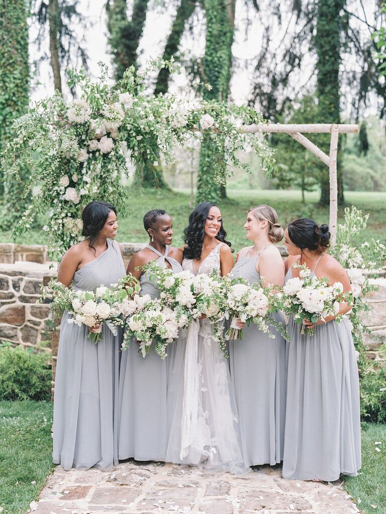 Bride posing with bridesmaids on wedding day