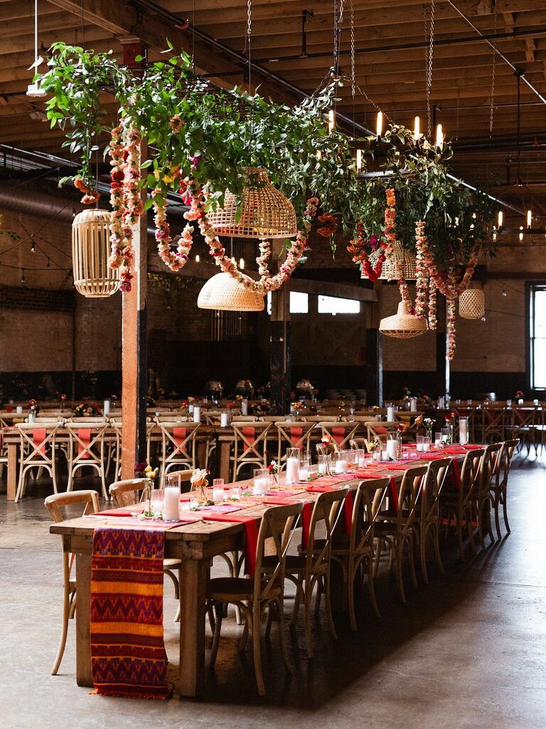 boho hanging wedding flowers with greenery vines, flower garland and mismatched rattan lampshades