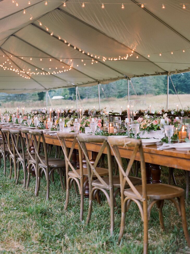 Warm and Inviting Reception Underneath A Tent Adorned With String Lights