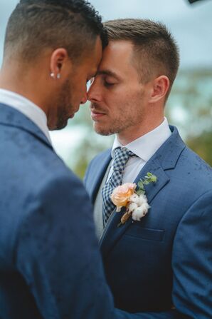 Grooms in Blue Suits Sharing Embrace During Elopement in Phuket, Thailand