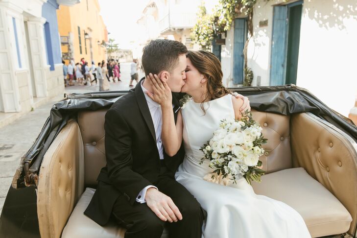 Bride and Groom in Getaway Carriage