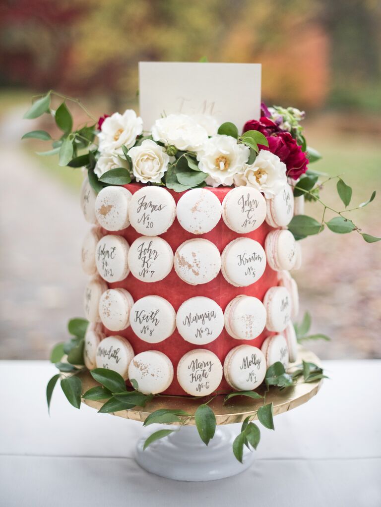one tier wedding cake decorated with macarons and fresh flowers