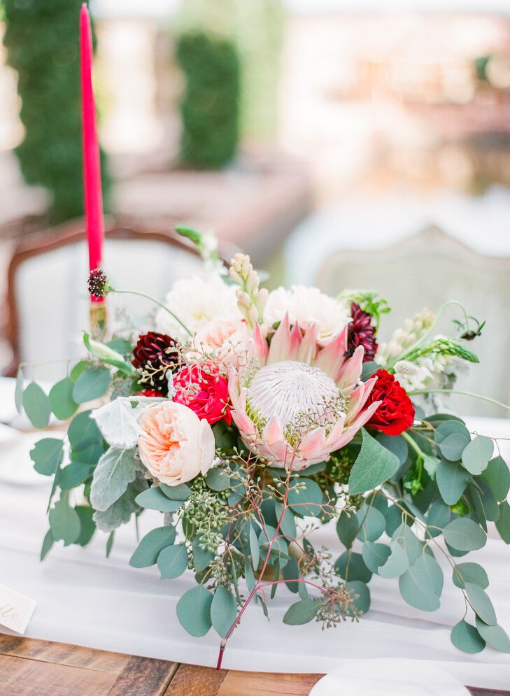 Michelle and Michael’s centerpieces complemented her bouquet with a blush king protea, eucalyptus and garden roses in different hues. All were arranged by Peplum Events and Design. “I had shot her wedding a few years back and had seen her work evolve over time. I loved working with her and felt she was the best person for our wedding,” says Michelle.