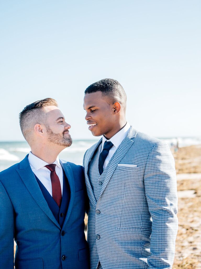 Grooms smiling at each other