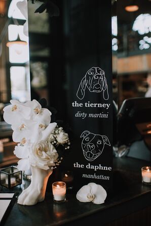 Black and White Dog-Themed Bar Sign with Orchid Arrangement