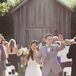 The couple held their wedding at the open-air Markham Museum where a 100-year-old rustic barn served as the backdrop for their summer ceremony.