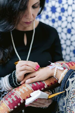 Traditional Henna on a Bride at Mehndi Before Wedding