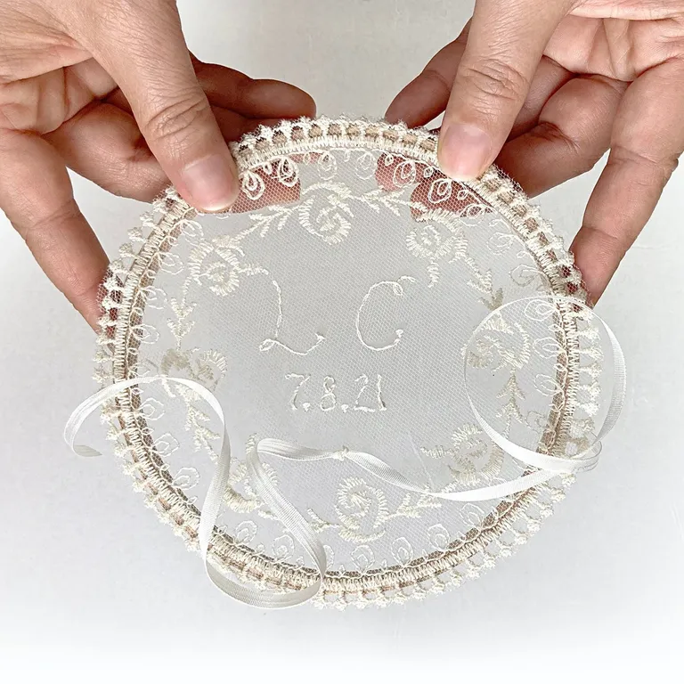 Personalized lace ring bearer pillow with initials and wedding date