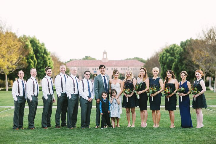 The bridesmaids wore their own navy dresses while the groomsmen wore casual gray slacks, leather suspenders and navy ties for a shabby chic look.