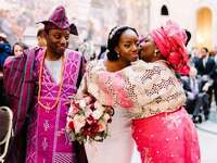 bride with parents during Nigerian wedding ceremony