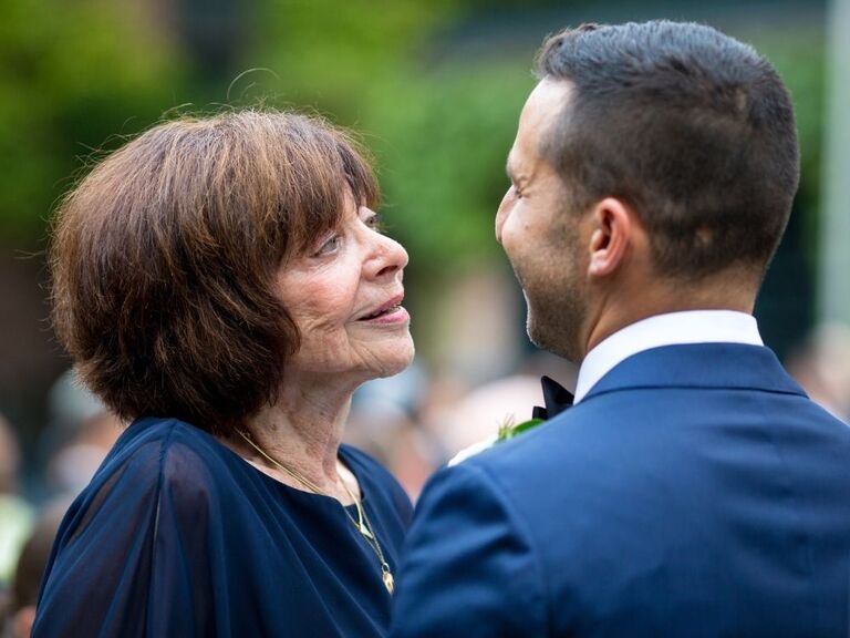 groom dancing with grandmother at wedding 