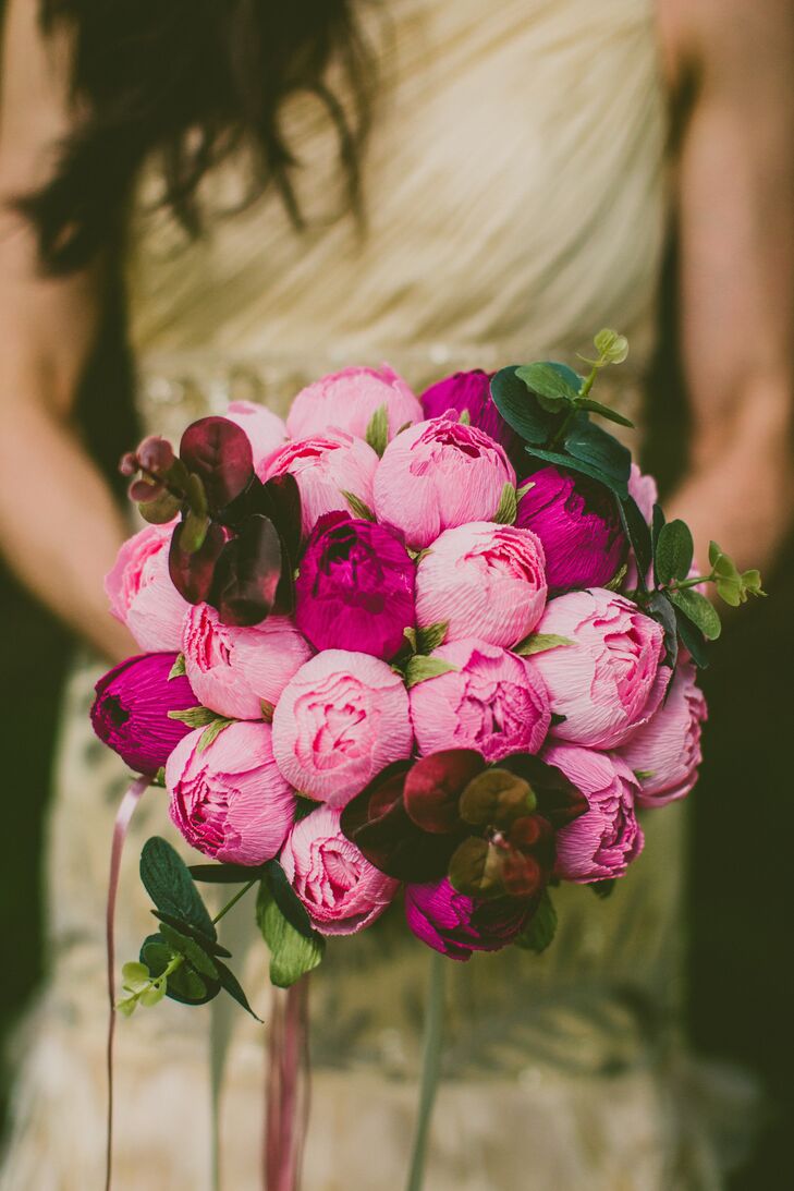 Kimberly's bridal bouquet was an array of pink crepe paper flowers that resembled peonies, which she bought from Mazziflowers on Etsy. “I wanted peonies, even though they were out of season. Paper flowers are always in season.”