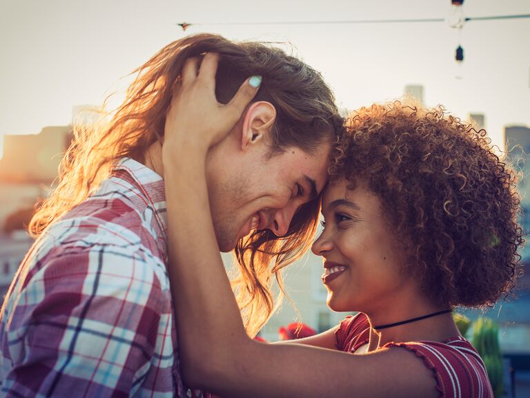 Couple smiling at each other.