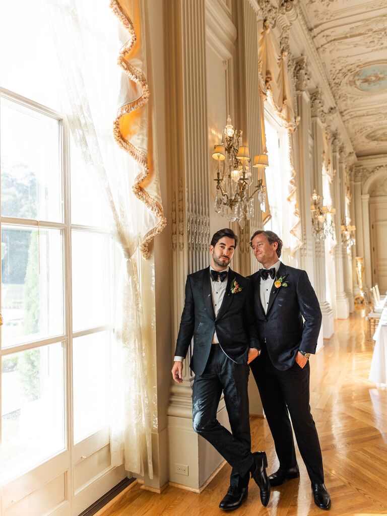 Whitaker Irvin and Michael Mendieta posing inside Rosecliff Mansion