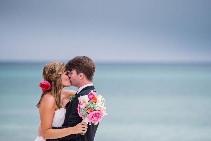 Caroline matched the rest of the women in the wedding party by putting a bright flower in her hair. The waterfall braid in her half-up hairstyle was paired with a fuchsia garden rose at the center. Everyone had a different look, but the flower helped tie them all together.