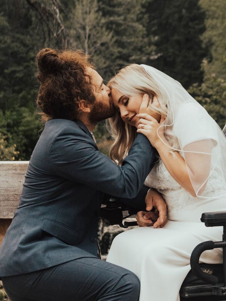 Couple kissing forehead