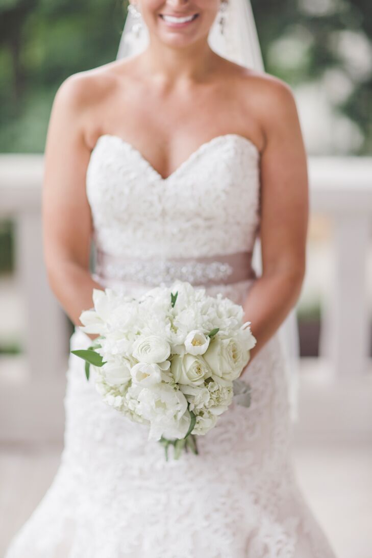 The ivory bridal bouquet was made up of peonies, roses and hydrangeas.