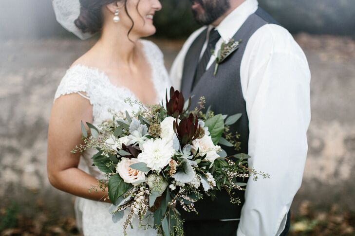 Angela's overflowing bouquet of blooms and greenery added a rustic touch to their vintage-inspired outfits.