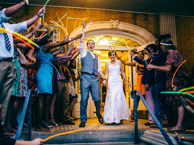 Bride and groom wedding send-off with glow sticks.