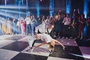 Groom Dramatically Dips Bride in Jumpsuit Back on Checkered Dance Floor