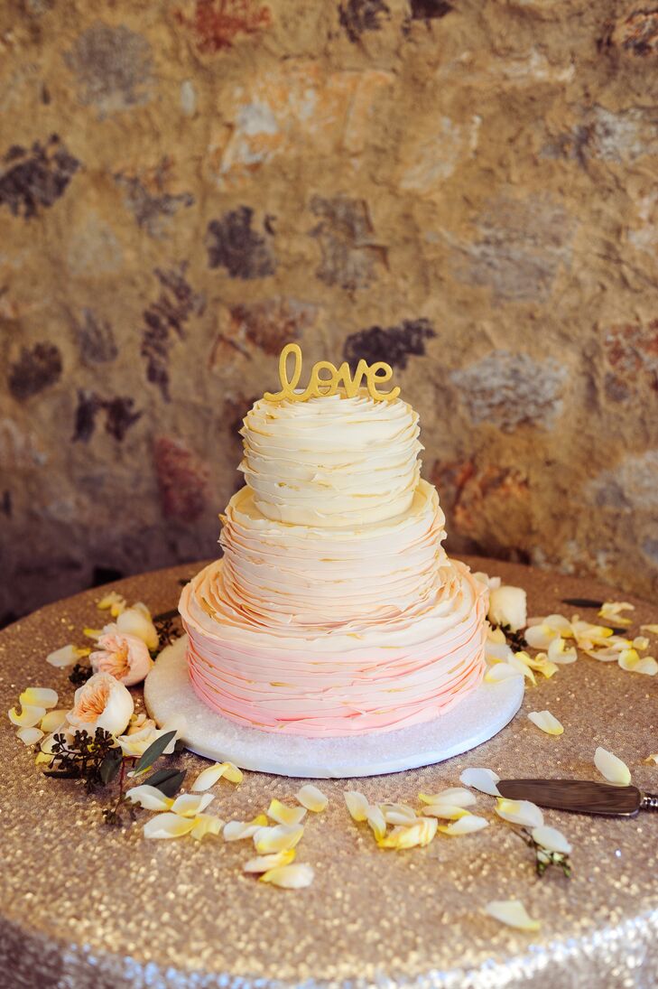 This beautiful ruffled ombre three-tier wedding cake was part of the French-themed dessert station, which included creme brulee, fruit tarts and churros with chocolate sauce.