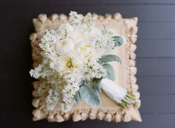 MBZ Design and Event Studio created the stunning florals for the wedding. Jennifer carried this white peony and delphinium arrangement down the aisle. She loved the textured look and how it set the tone for an overgrown garden wedding.