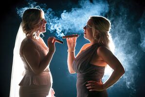 Bride and Bridesmaid Enjoying Cigars