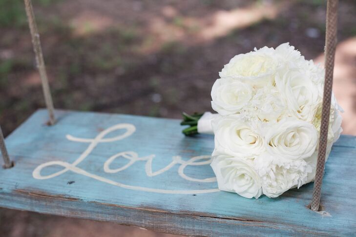 Nikki carried white roses and peonies for a lush, classic bridal bouquet.
