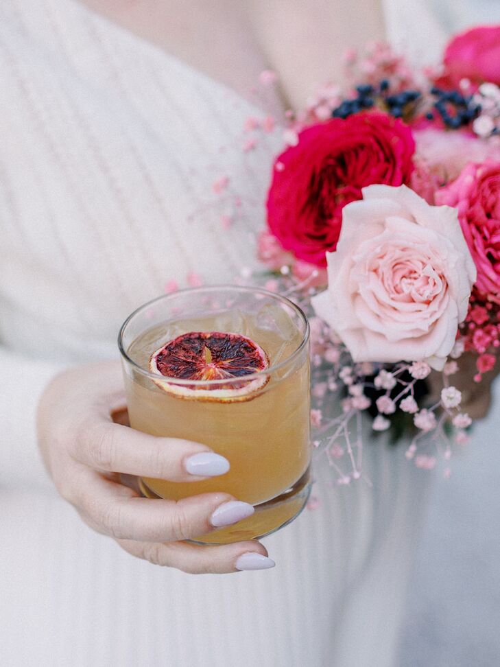 Orange Cocktail With Burnt Orange Slice at a Fall Wedding
