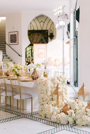 Cascading White Flowers Off of Dining Table at Wedding Mehndi Celebration