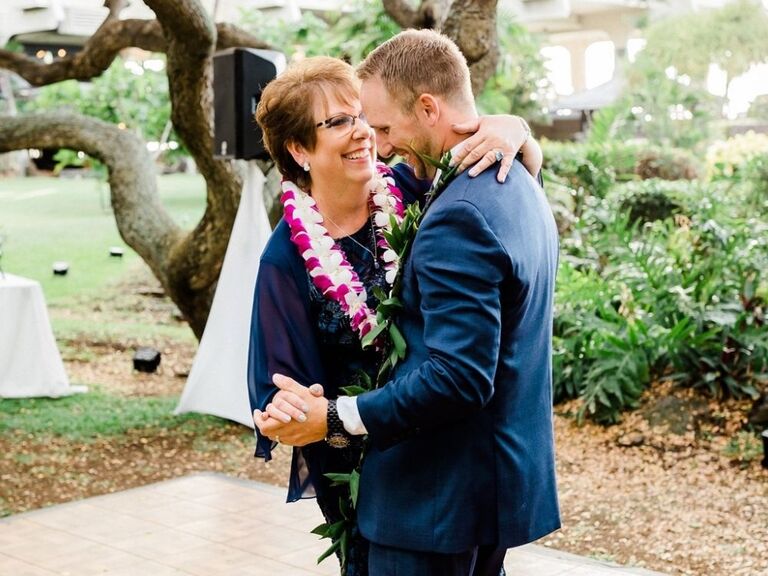 mother of the groom dancing with groom at wedding