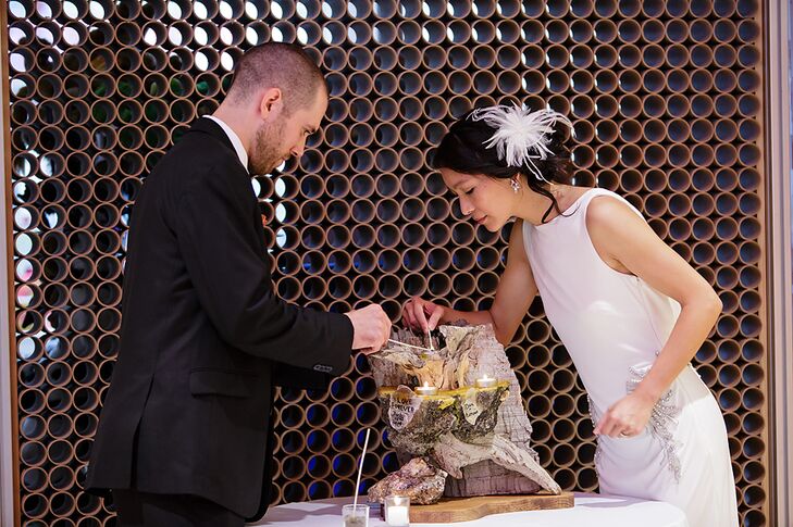 After their parents lit their individual unity candles, the bride and groom lit their final unity candle together during their ceremony.