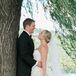 Couple Shot Leaning Against Tree