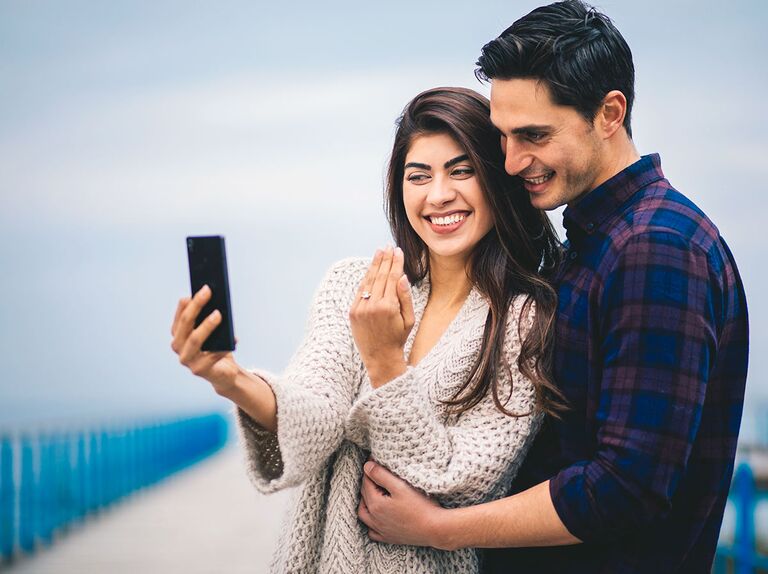 couple taking engagement selfie