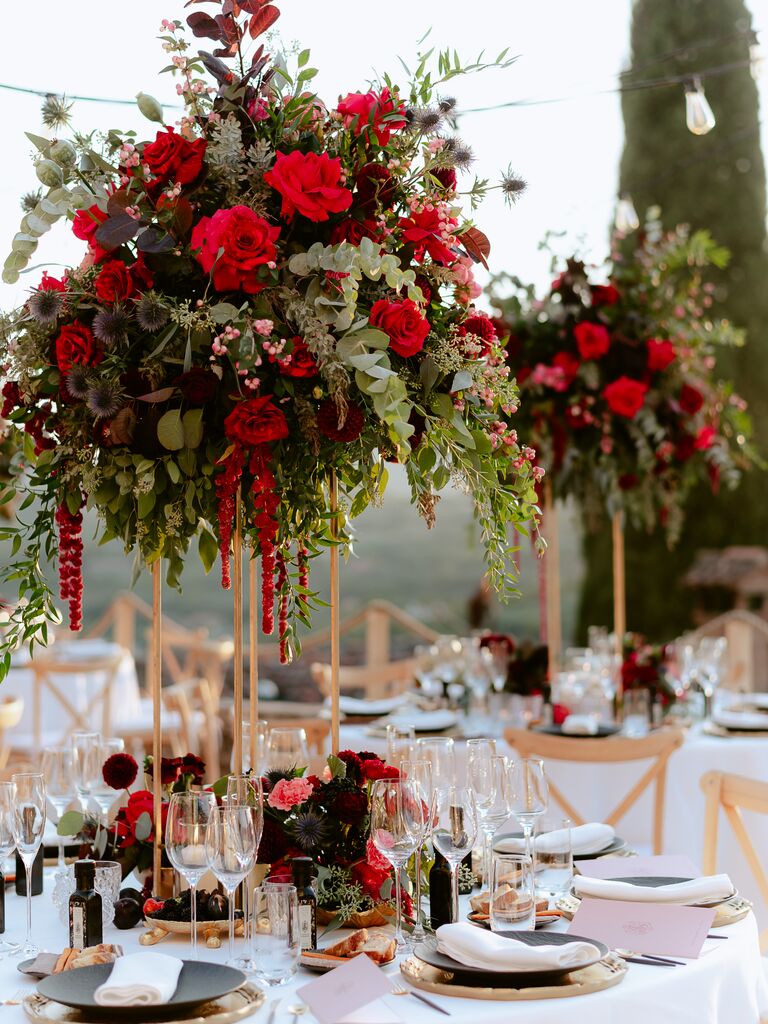 Romantic tall flower centerpieces in shades of red and green
