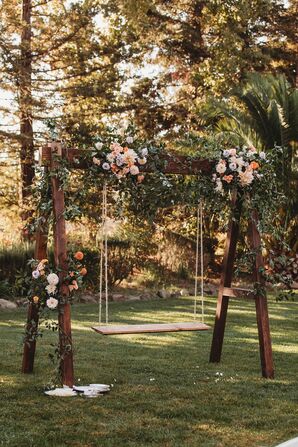 Wood Frame Oonjal Swing Set With Greenery, Flowers at Indian Baraat Ceremony, Winery