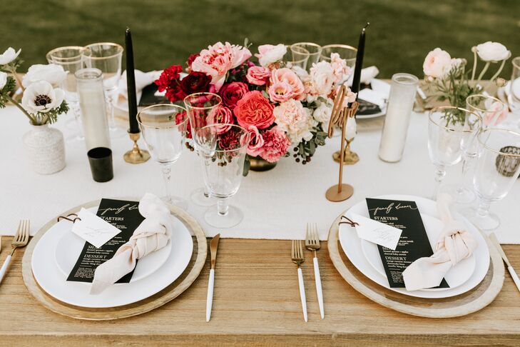 Black and White Dining Table Scheme with Gold Accents and Pink Centerpiece