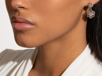 Two twisted gold and silver knots, one dangling