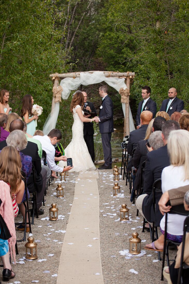 “We both enjoy being outdoors and love living in Colorado, so we wanted to make sure our wedding took advantage of the beautiful mountain scenery,” Melissa says. The Silverthorne Town Pavilion did just that, the ceremony site affording stunning views of the natural landscape, including the nearby river and mountains.