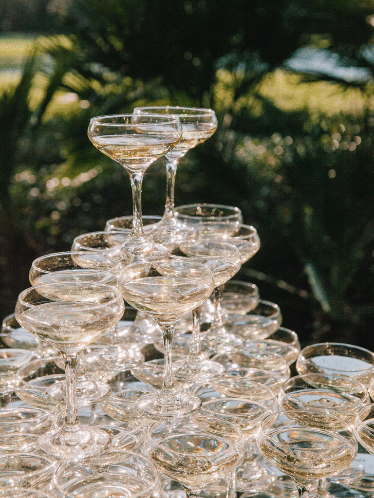 Colorful champagne tower at an outdoor reception. 