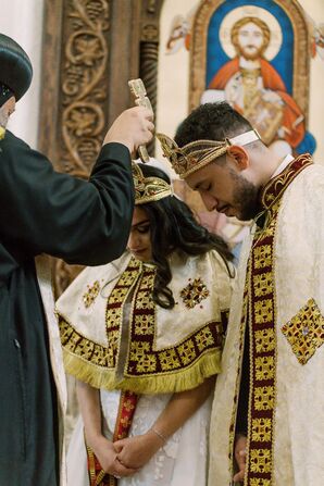 Officiant Offering Blessing to Bride and Groom During Egyptian Coptic Orthodox Ceremony