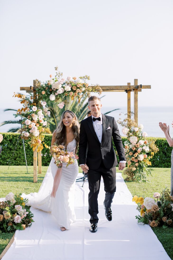 Bride and Groom Recessional, Lawn Ceremony, Neutral Colors, Flowers on Wooden Arch