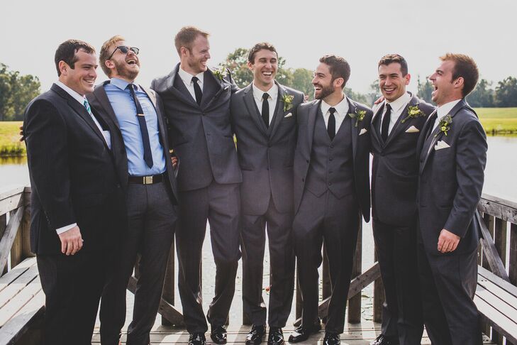 The groomsmen wore gray tuxedo by Vera Wang for Men's Warehouse with black ties and white boutonnieres.