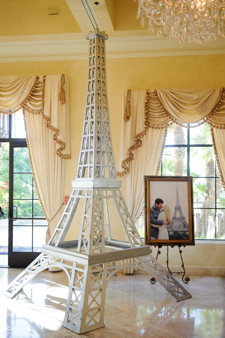A model Eiffel Tower was available for guests to take pictures in front of. This piece was important to the couple because during one of their vacation trips, they stopped quickly at the Eiffel Tower and took engagement photos (with one displayed in the back).