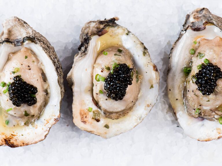 Charbroiled Oysters on the Half Shell Served With Garlic Butter and Khavyar's Osetra Galilee Prime