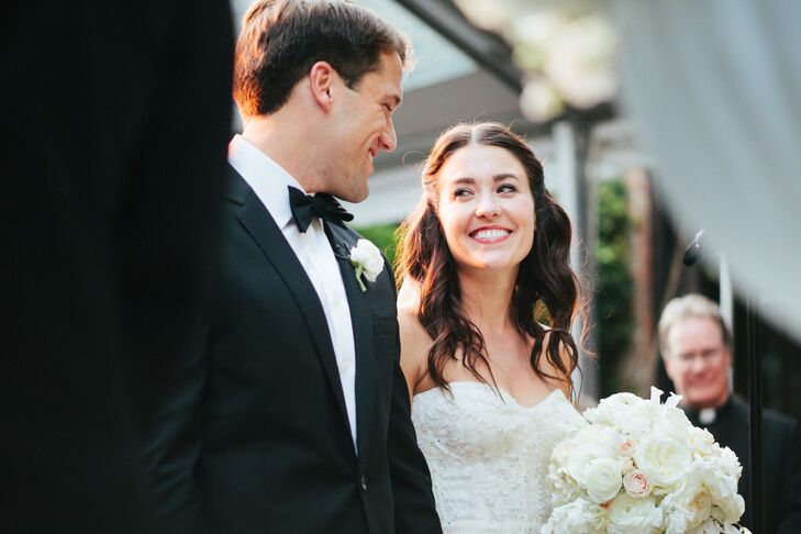 The bride opted to wear her hair in a half up style secured on each side with vintage combs. "Since my dress was so detailed, I really wanted to keep my look simple," she says. "I knew if I went overboard with my hair an makeup that I wouldn't have felt like myself."