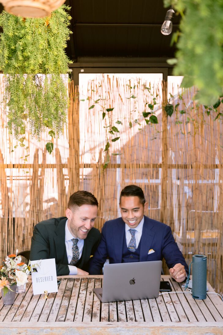 Grooms Video Chatting During Wedding Reception