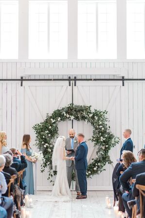 Elegant Barn Ceremony with Oversize Wreath Backdrop