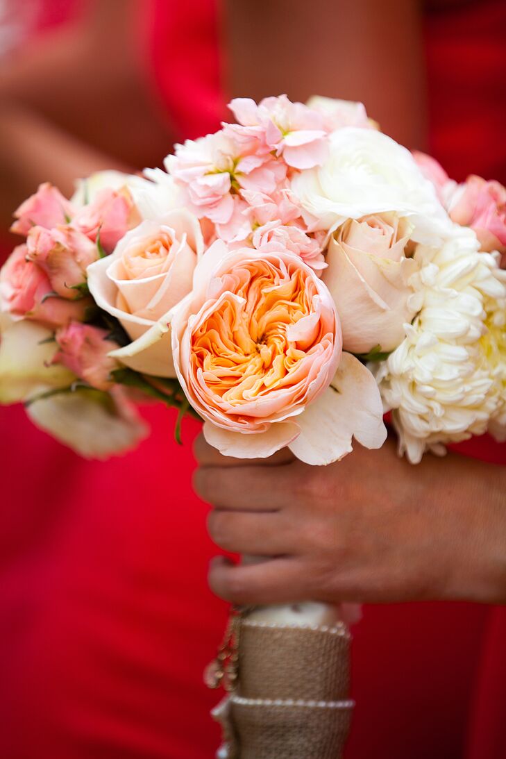 "The girls' flowers were peach and coral flowers with white," Veronica says. "Each of their bouquets had a meaningful charm that we put on together before the wedding."