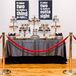 Hip-Hop-Inspired Dessert Table with Silver Linen, Red Ropes and Lyric Signs